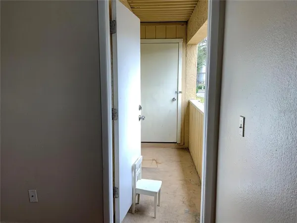 a room with a refrigerator and a sink