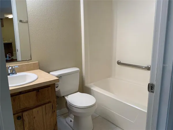a view of a bathroom with a glass door