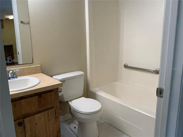 a view of a bathroom with a glass door
