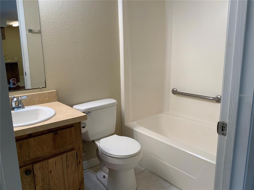 233 Red Maple Place, Unit 233 Brandon, FL 33510 - Photo 9 of 16 a bathroom with a sink toilet and shower