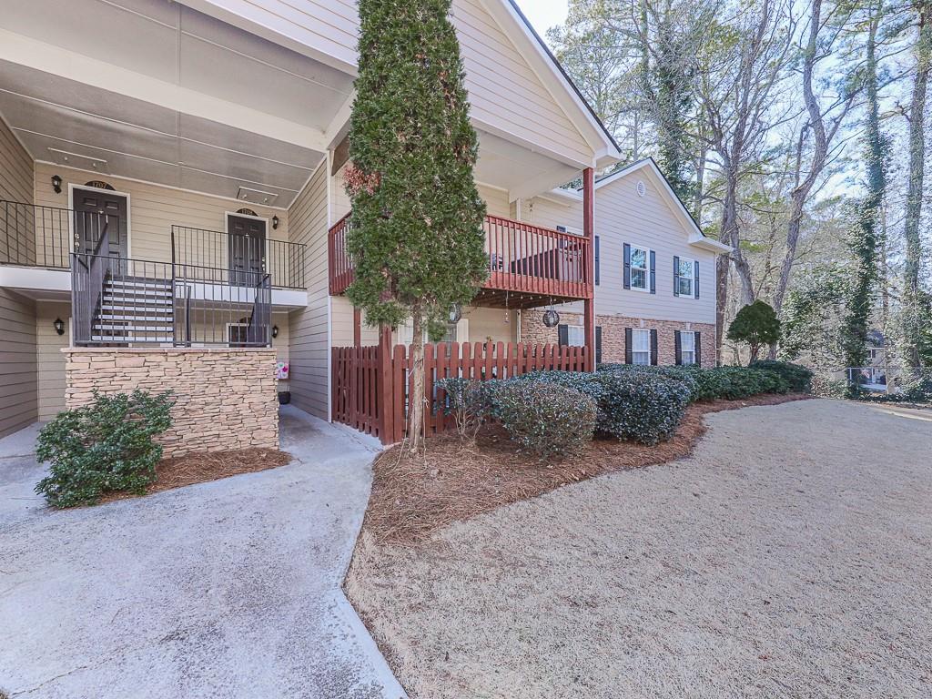 1708 Brighton Point Atlanta, GA 30328 - Photo 2 of 31 a front view of a house with garden