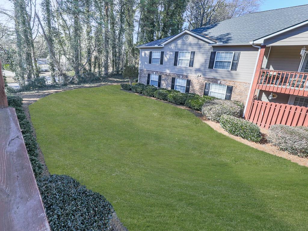 1708 Brighton Point Atlanta, GA 30328 - Photo 25 of 31 a front view of a house with garden