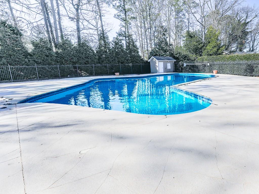 1708 Brighton Point Atlanta, GA 30328 - Photo 29 of 31 a view of a swimming pool with an outdoor space