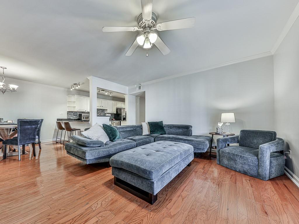 1708 Brighton Point Atlanta, GA 30328 - Photo 7 of 31 a living room with furniture and a chandelier