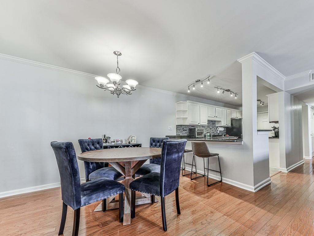 1708 Brighton Point Atlanta, GA 30328 - Photo 8 of 31 a view of a dining room with furniture and wooden floor