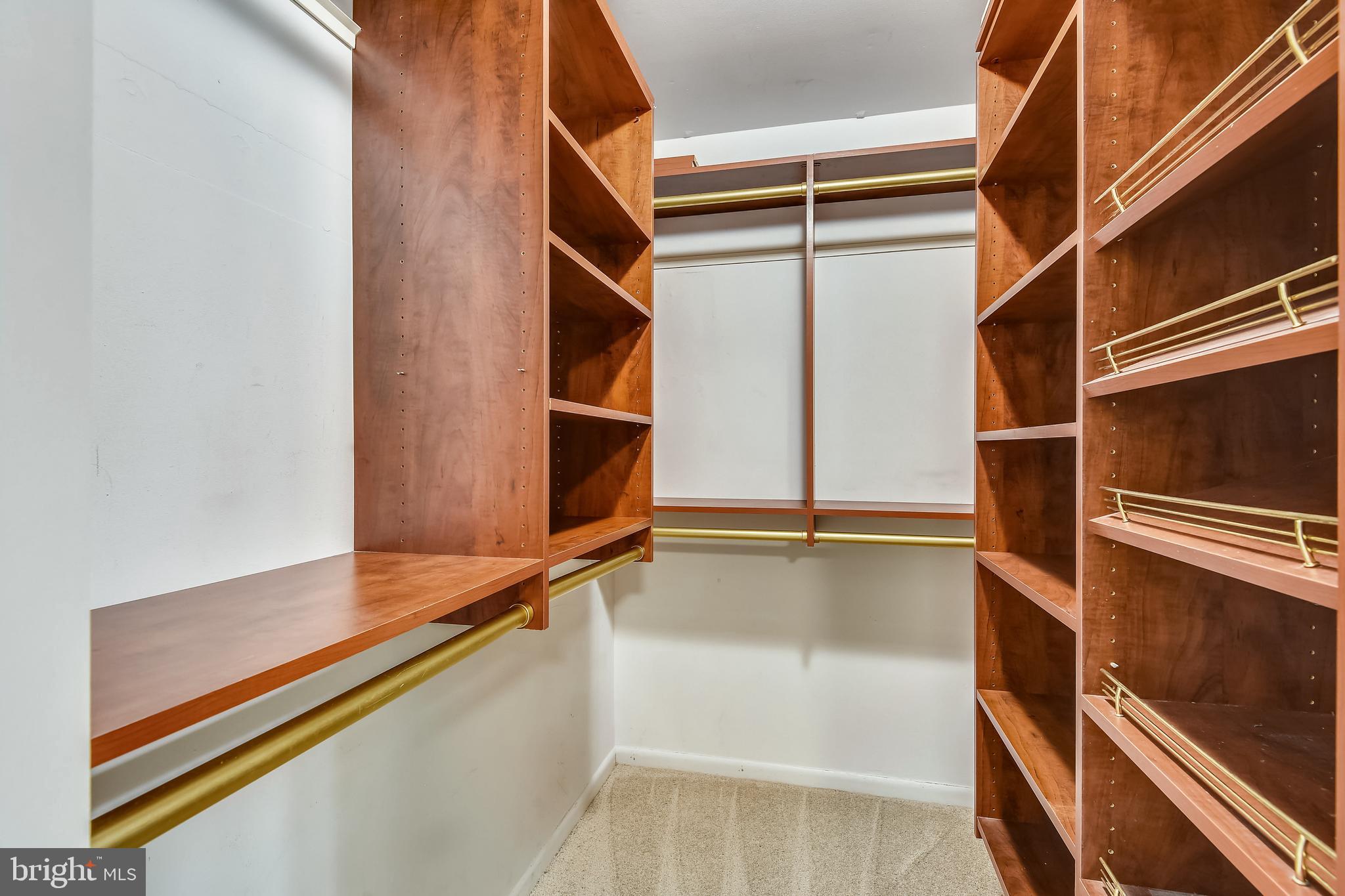 1435 Northgate Square, Unit 22B Reston, VA 20190 - Photo 20 of 49 Master walk in closet with custom shelves