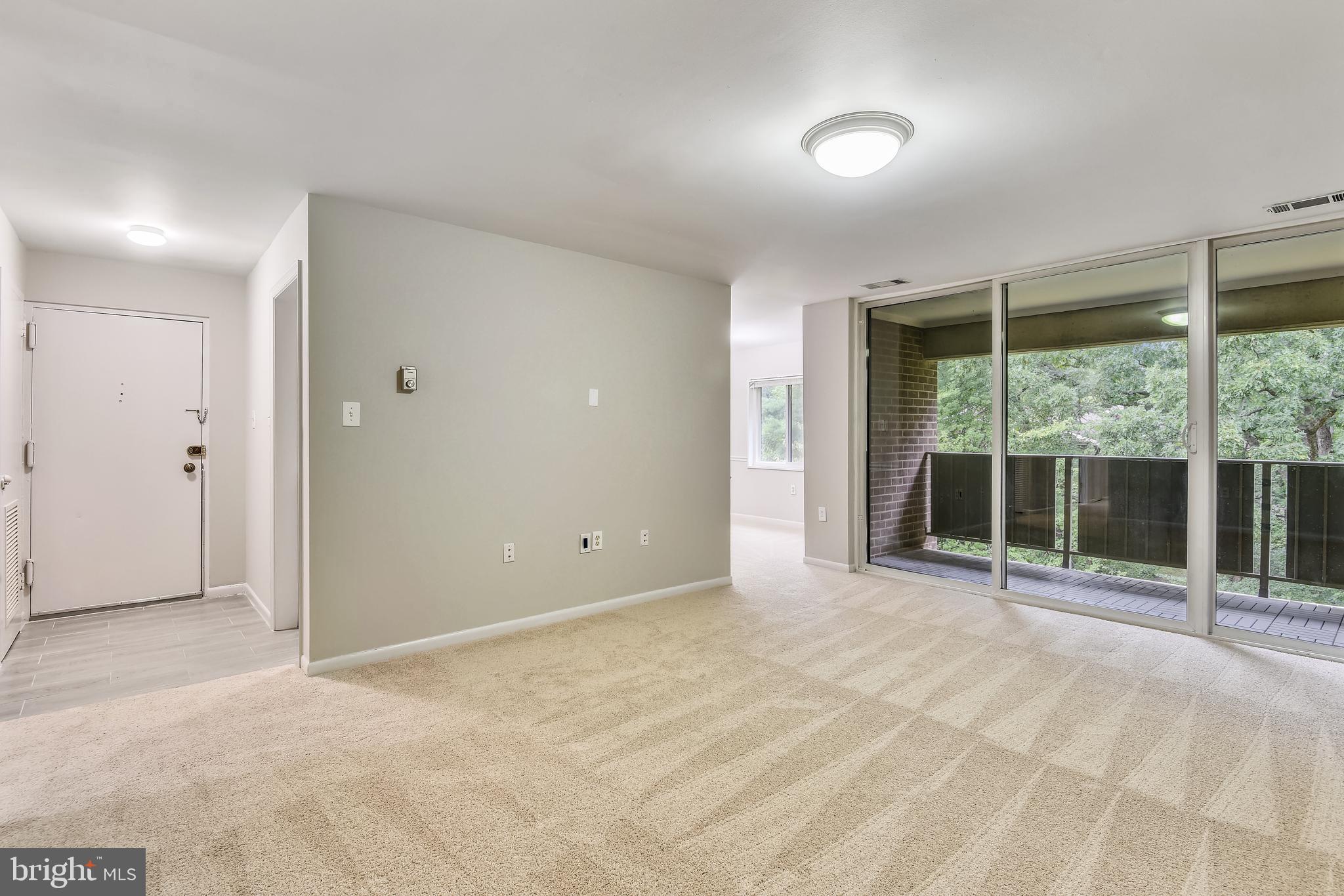 1435 Northgate Square, Unit 22B Reston, VA 20190 - Photo 9 of 49 Living Room looking out to balcony
