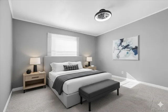 a bedroom with a bed and a lamp