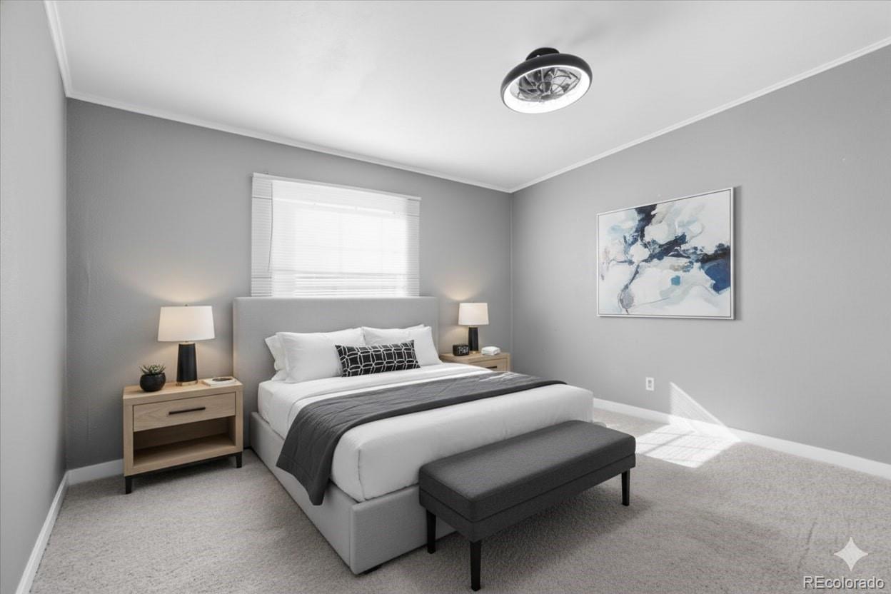 218 Grape Street Hudson, CO 80642 - Photo 16 of 22 a bedroom with a bed and a lamp