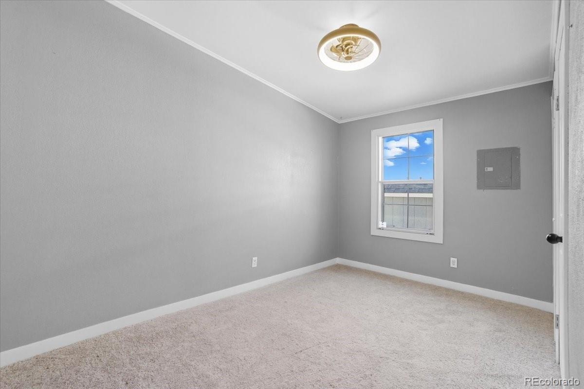 218 Grape Street Hudson, CO 80642 - Photo 19 of 22 an empty room with a window
