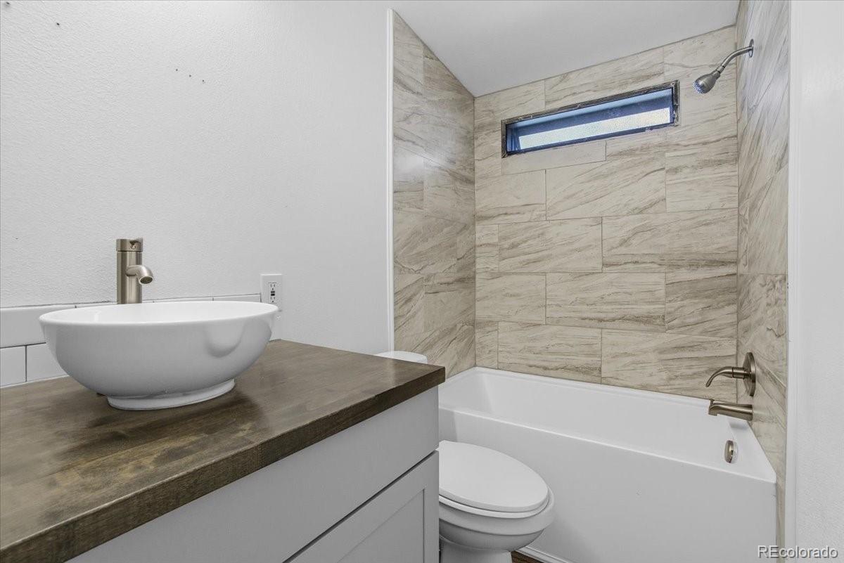 218 Grape Street Hudson, CO 80642 - Photo 21 of 22 a view of a bathtub in a bathroom