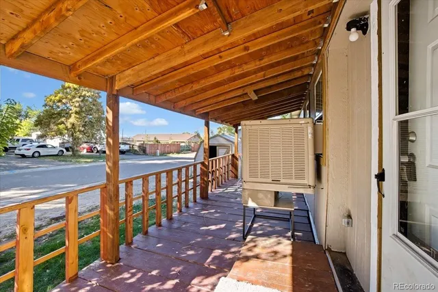 a view of a porch with wooden floor