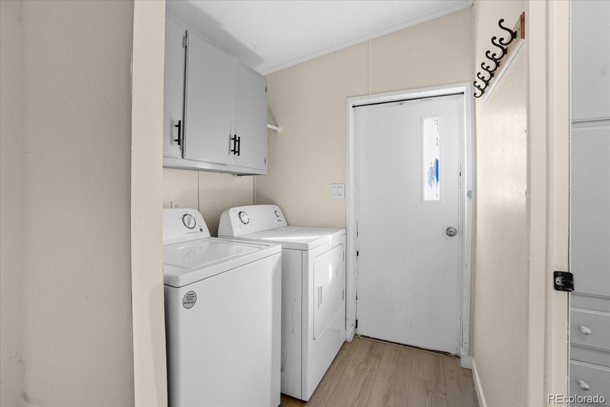 218 Grape Street Hudson, CO 80642 - Photo 10 of 22 a utility room with dryer and washer