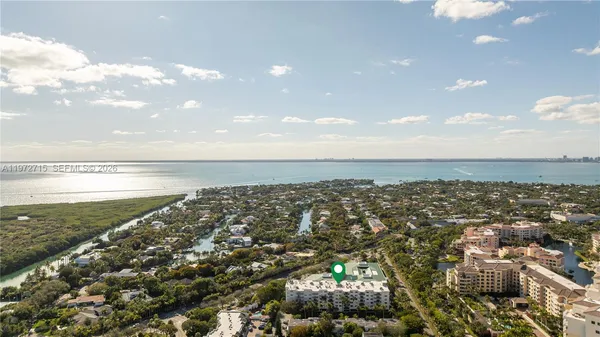 a view of a entryway door with potted plants