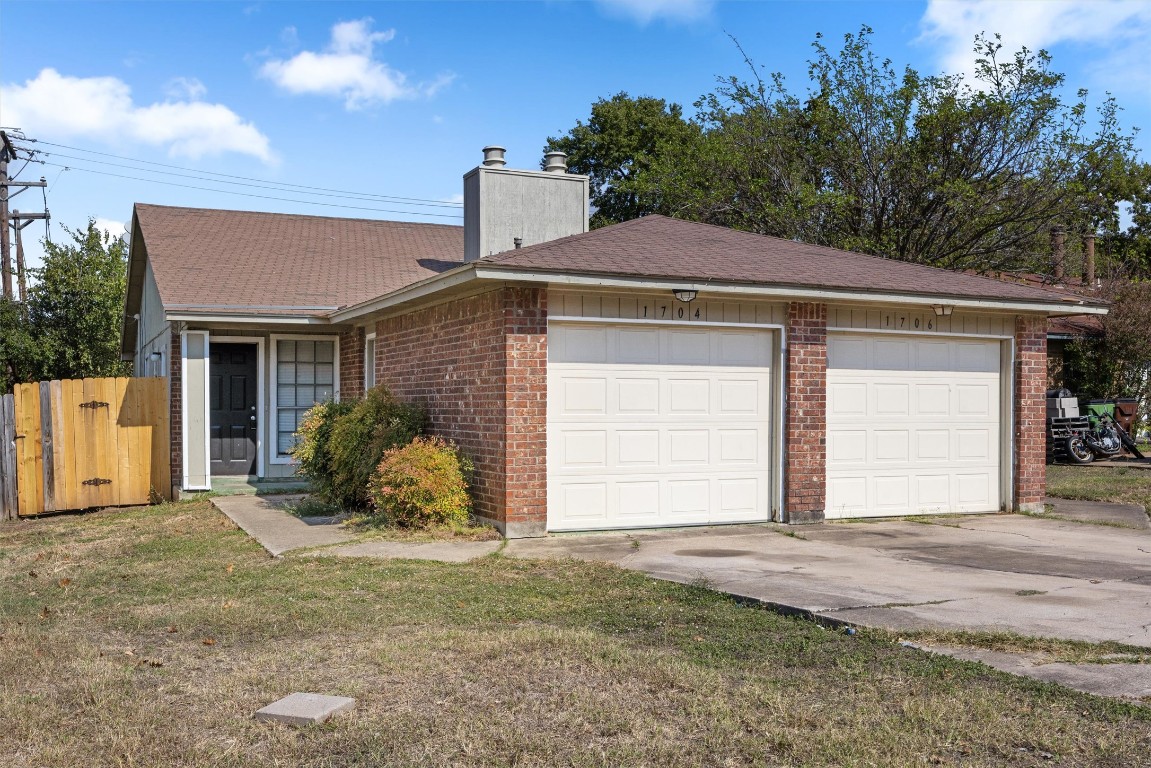 1704 Rawhide Loop Round Rock, TX 78681 - Photo 1 of 11 a front view of a house with a yard and garage