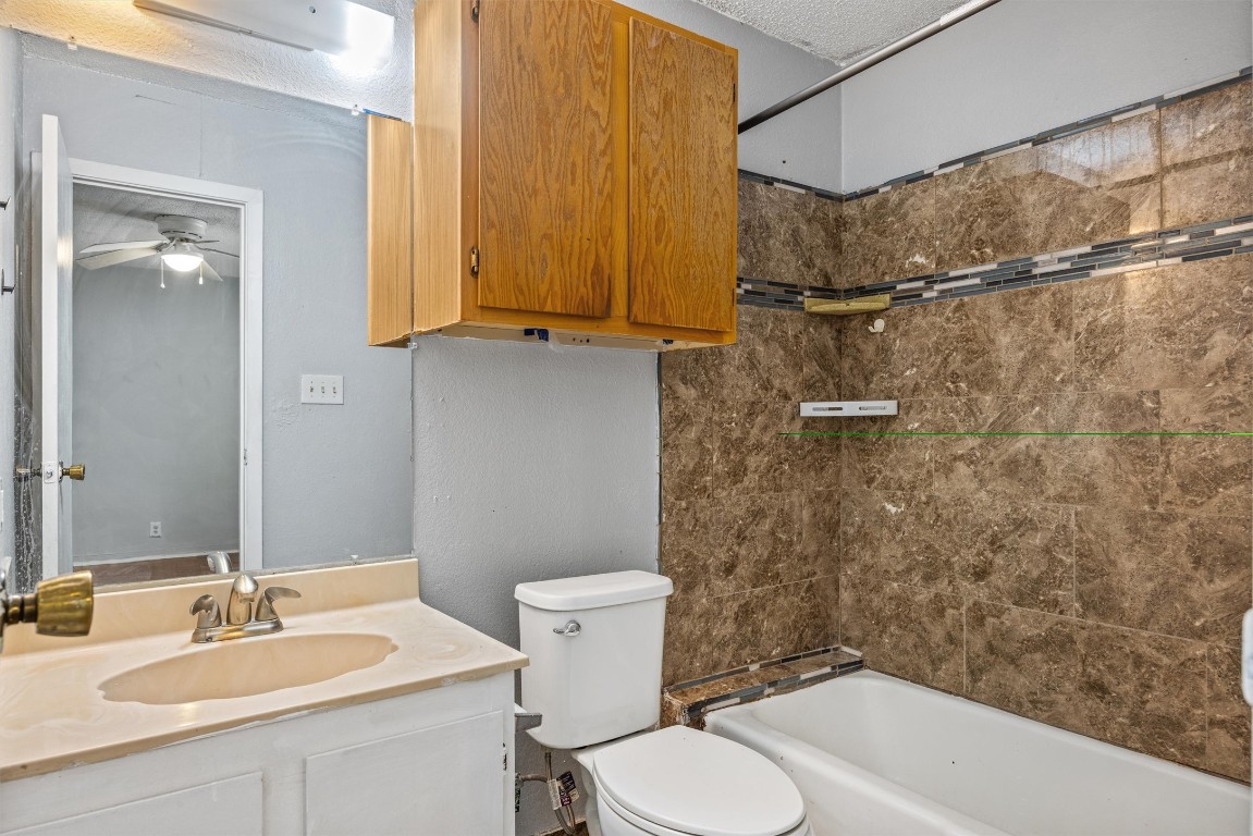 1704 Rawhide Loop Round Rock, TX 78681 - Photo 10 of 11 a bathroom with a sink toilet and shower