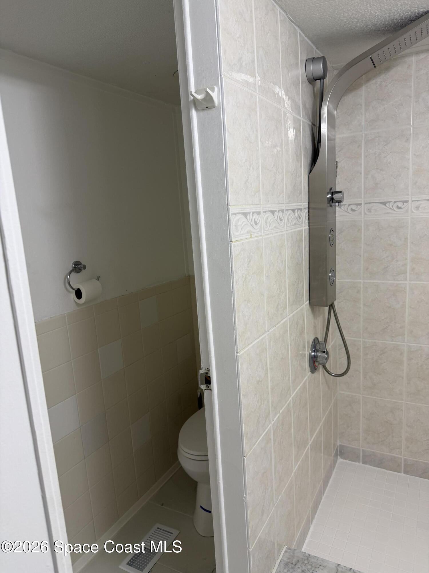 2132 Rocway Drive Melbourne, FL 32935 - Photo 12 of 16 a bathroom with a shower and toilet