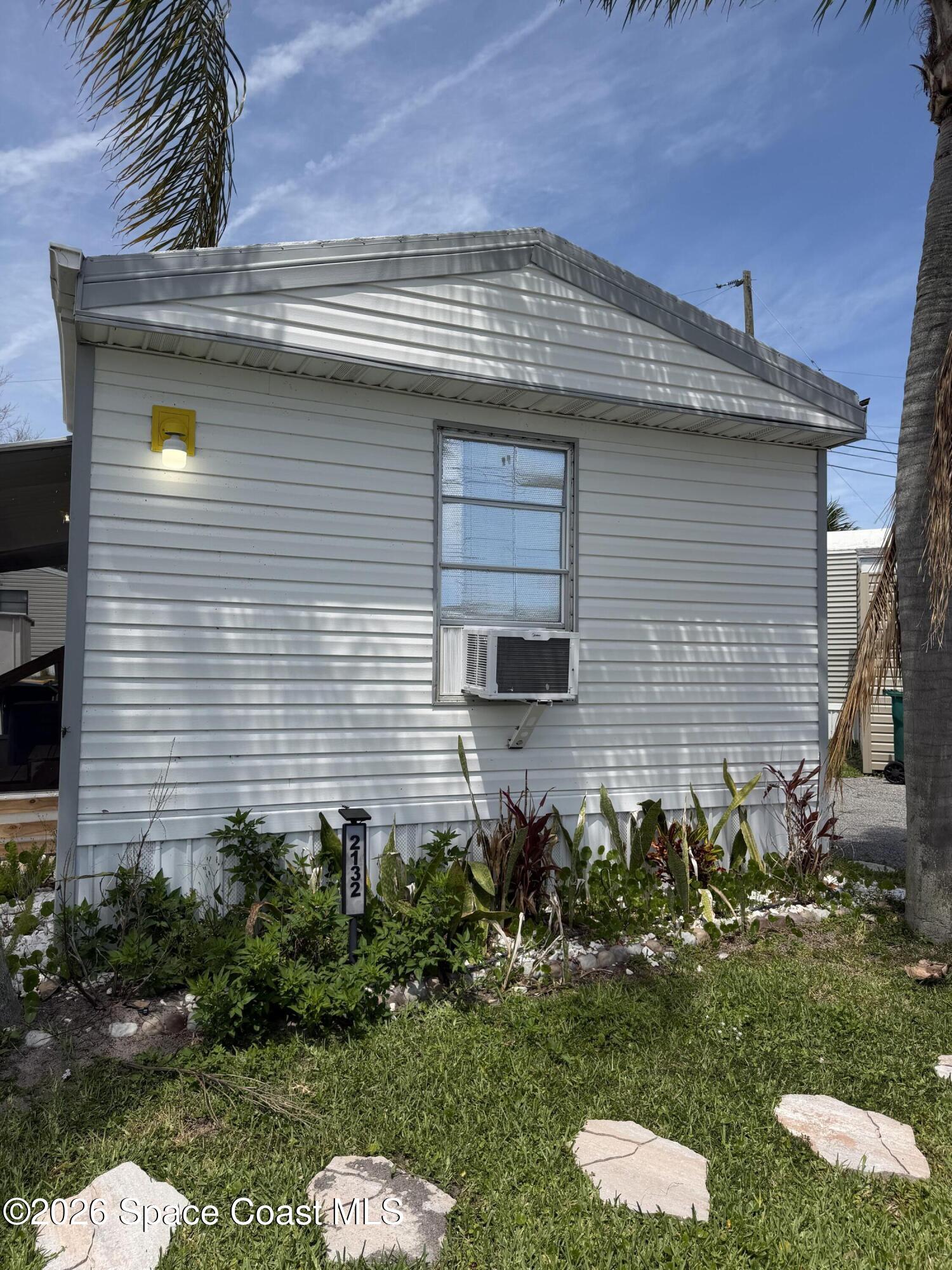 2132 Rocway Drive Melbourne, FL 32935 - Photo 16 of 16 a front view of a house with a yard