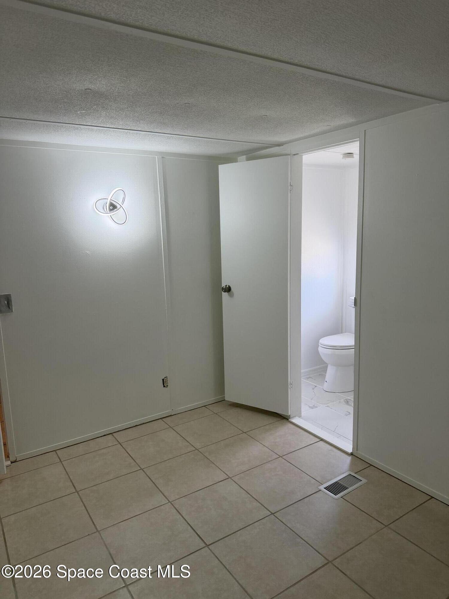 2132 Rocway Drive Melbourne, FL 32935 - Photo 7 of 16 a view of an empty room