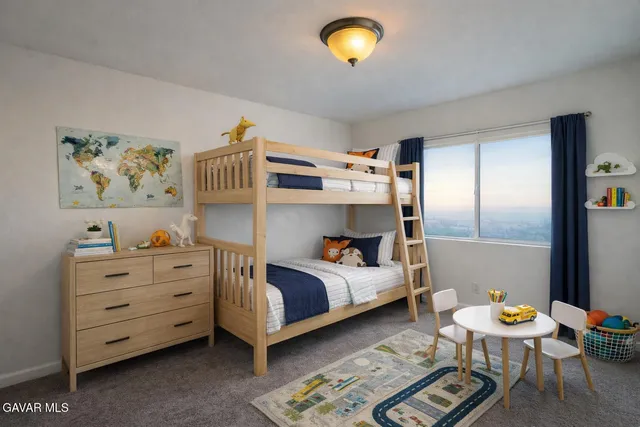 a bedroom with a bed and furniture