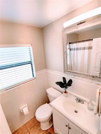 a bathroom with a bath tub with a shower