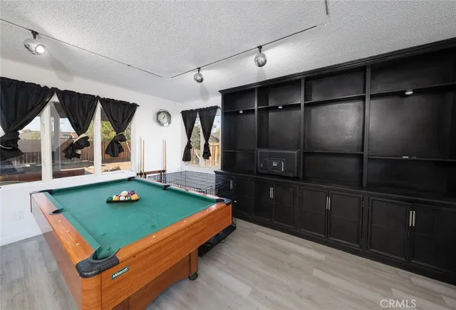 a bedroom with furniture and a wooden floor