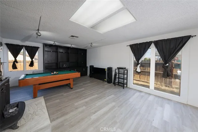 a view of yard with patio