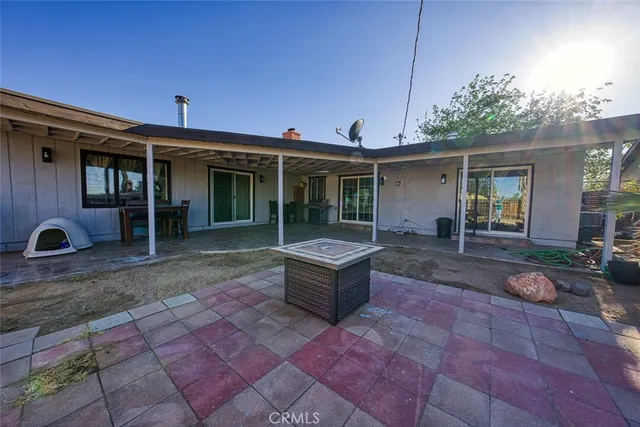 a view of a backyard with a patio
