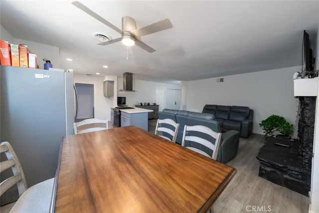 a bedroom with furniture and a wooden floor
