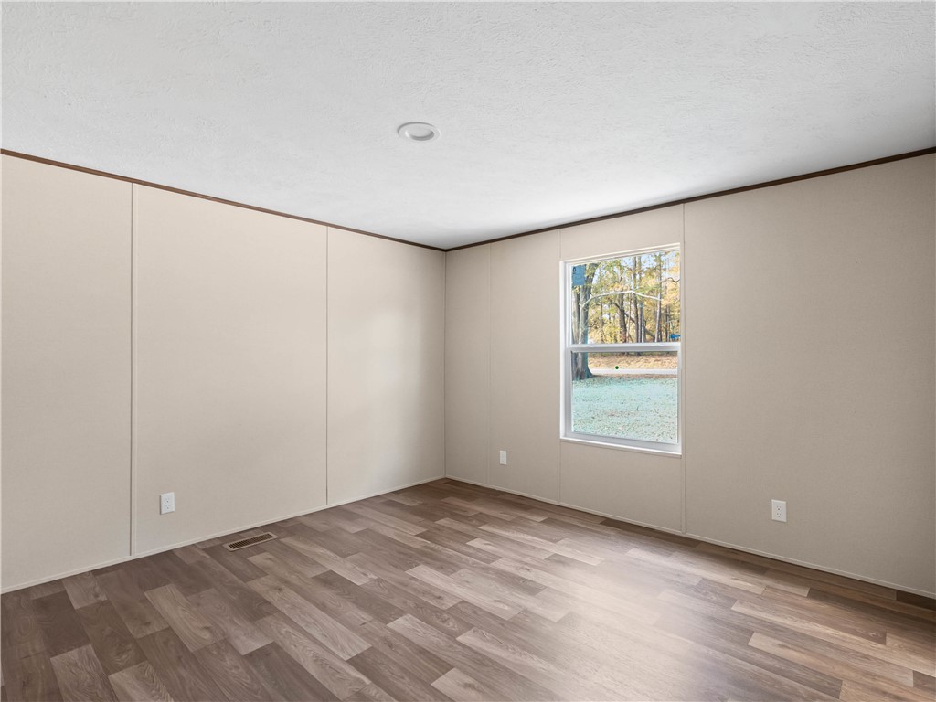 401 Mormon Church Road Seneca, SC 29678 - Photo 27 of 43 This spacious room offers versatile living with durable flooring and ample natural light.