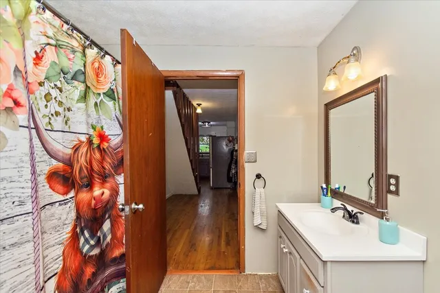 a backyard of a house with lots of green space and plants