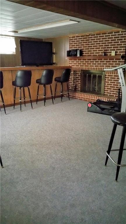 177 Highway 68 Rochester, PA 15074 - Photo 22 of 25 Finished basement features bar and gas fireplace.