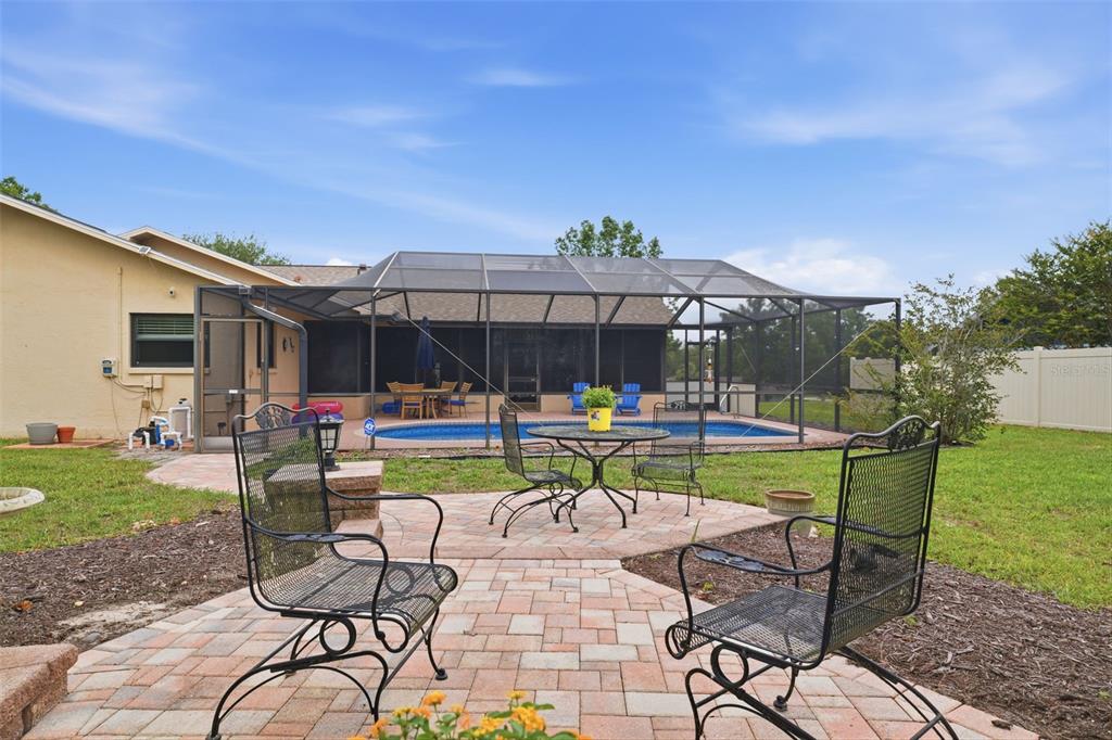 5227 Suwannee Road Weeki Wachee, FL 34607 - Photo 43 of 62 a view of swimming pool and patio with a garden