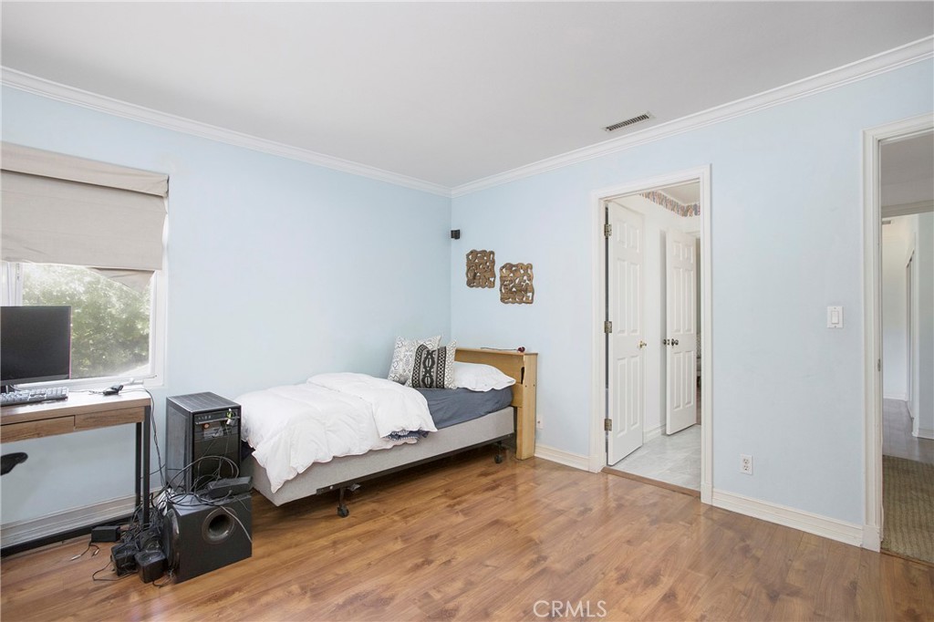 11376 Loch Lomond Road Los Alamitos, CA 90720 - Photo 25 of 32 a bedroom with a workspace