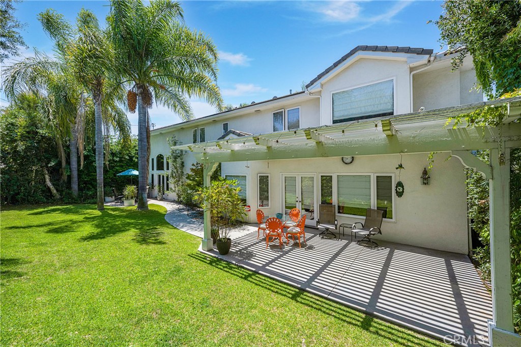 11376 Loch Lomond Road Los Alamitos, CA 90720 - Photo 28 of 32 a view of a house with backyard porch and sitting area