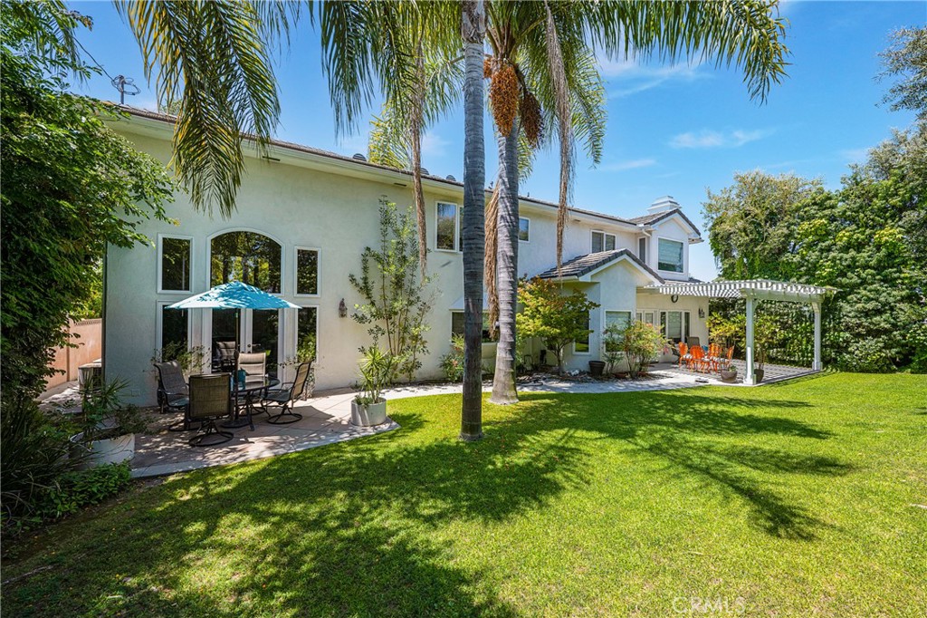 11376 Loch Lomond Road Los Alamitos, CA 90720 - Photo 29 of 32 a view of a house with a yard