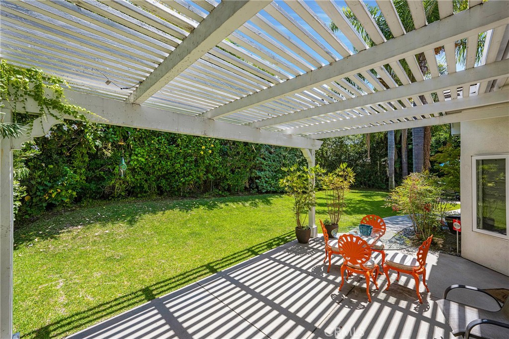 11376 Loch Lomond Road Los Alamitos, CA 90720 - Photo 30 of 32 a front view of a house with garden