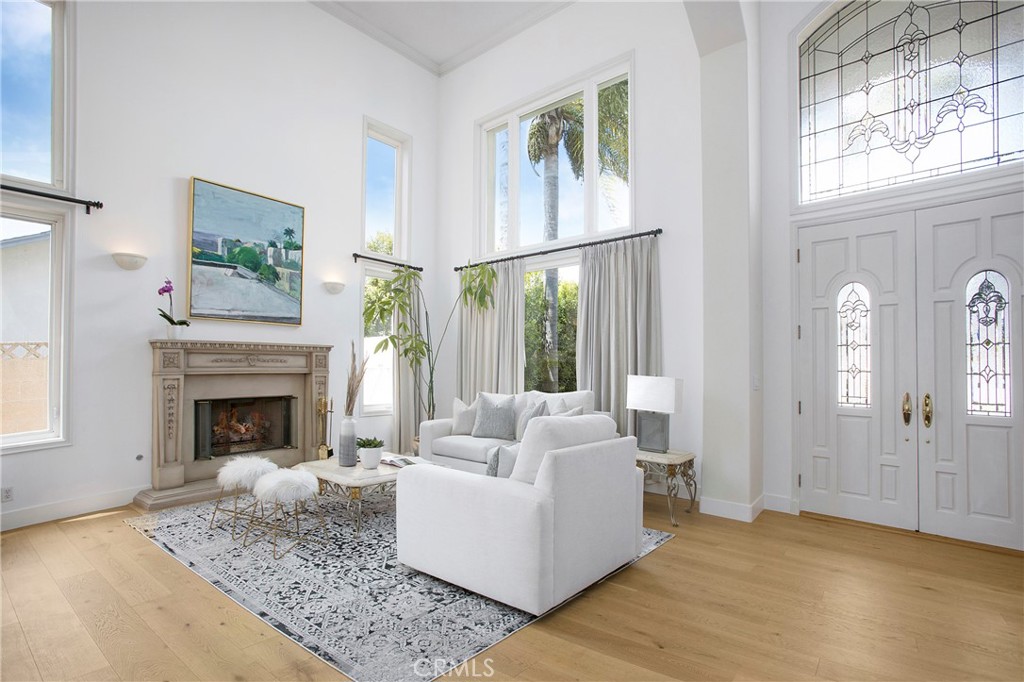 11376 Loch Lomond Road Los Alamitos, CA 90720 - Photo 3 of 32 a living room with furniture and a fireplace