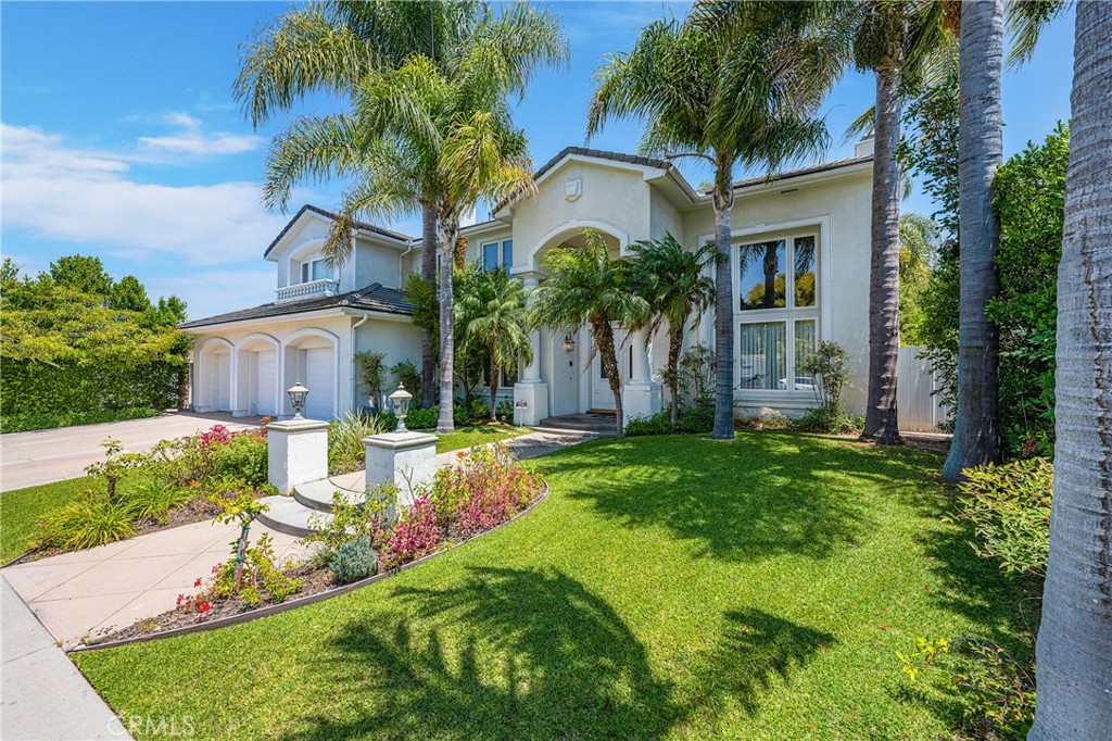 11376 Loch Lomond Road Los Alamitos, CA 90720 - Photo 32 of 32 a front view of house with yard and green space
