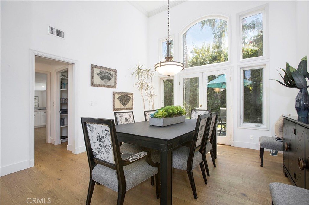 11376 Loch Lomond Road Los Alamitos, CA 90720 - Photo 7 of 32 a view of a dining room with furniture window and wooden floor