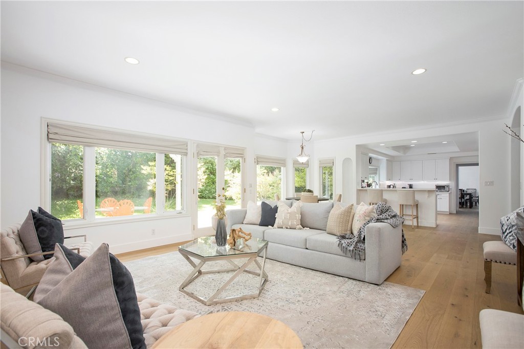 11376 Loch Lomond Road Los Alamitos, CA 90720 - Photo 8 of 32 a living room with furniture and a large window