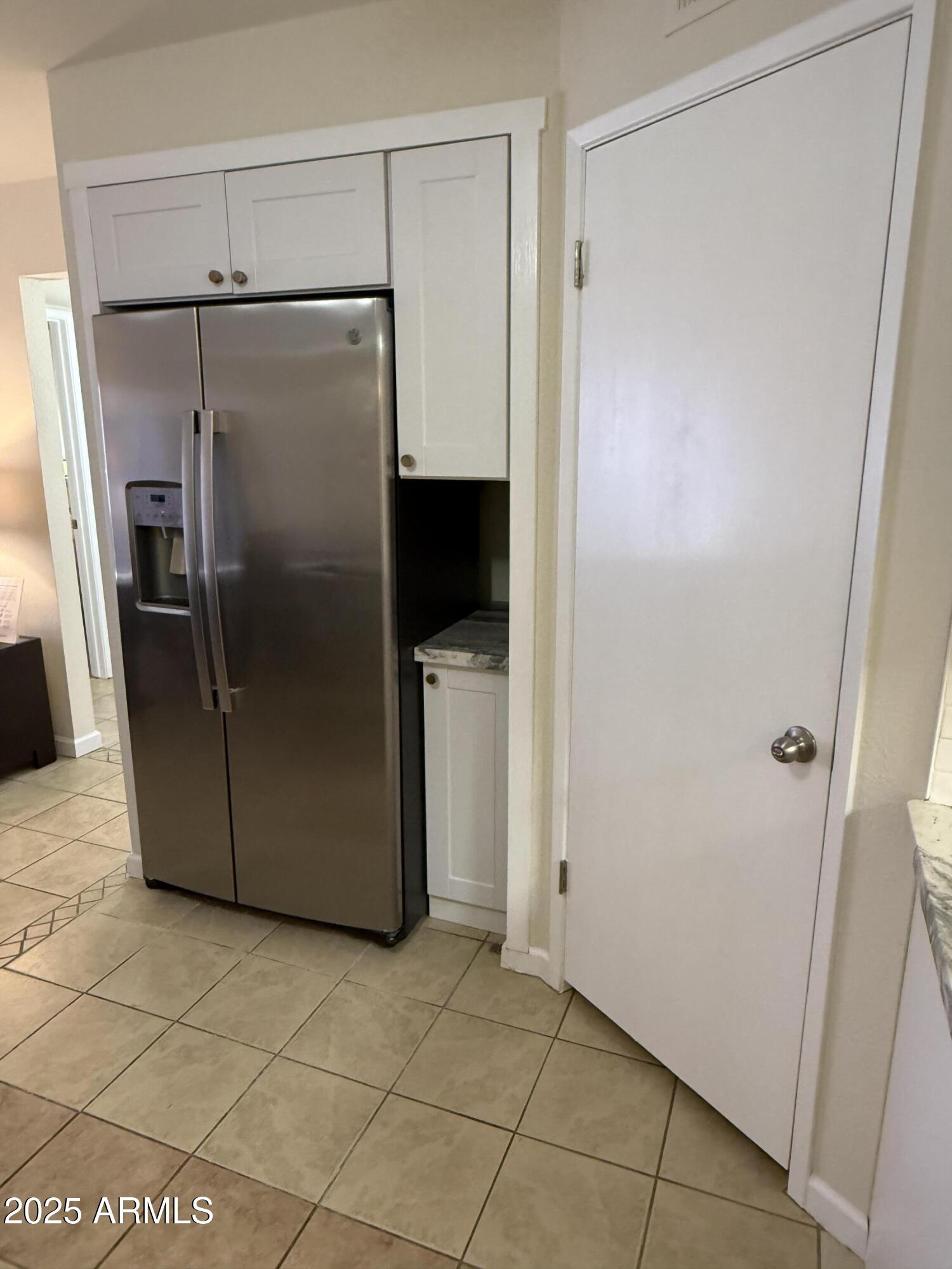 540 South West Road, Unit 24 Wickenburg, AZ 85390 - Photo 4 of 23 a metallic refrigerator freezer sitting in a kitchen