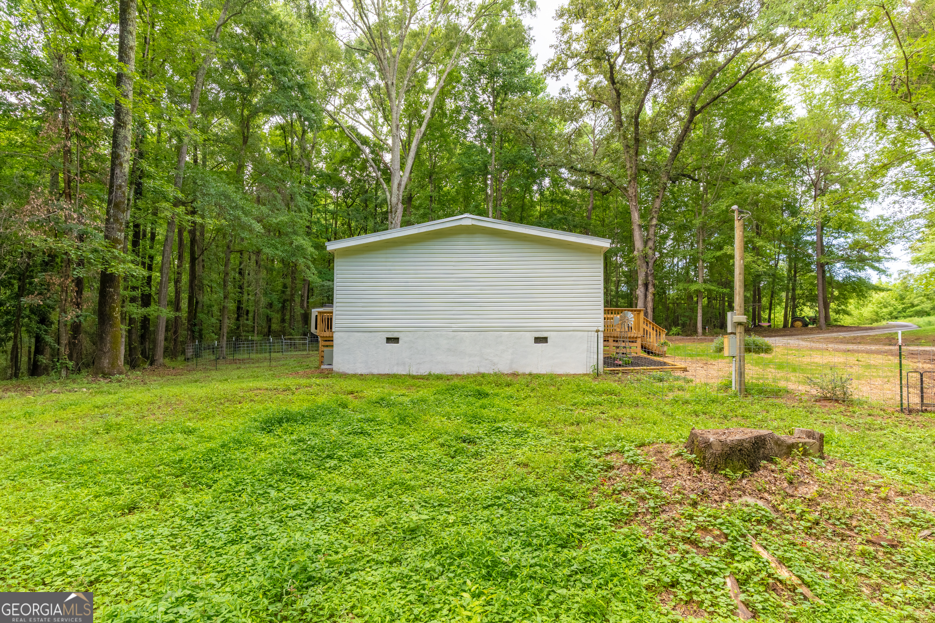 452 Aikenton Road Monticello, GA 31064 - Photo 34 of 47 a view of backyard of house with green space