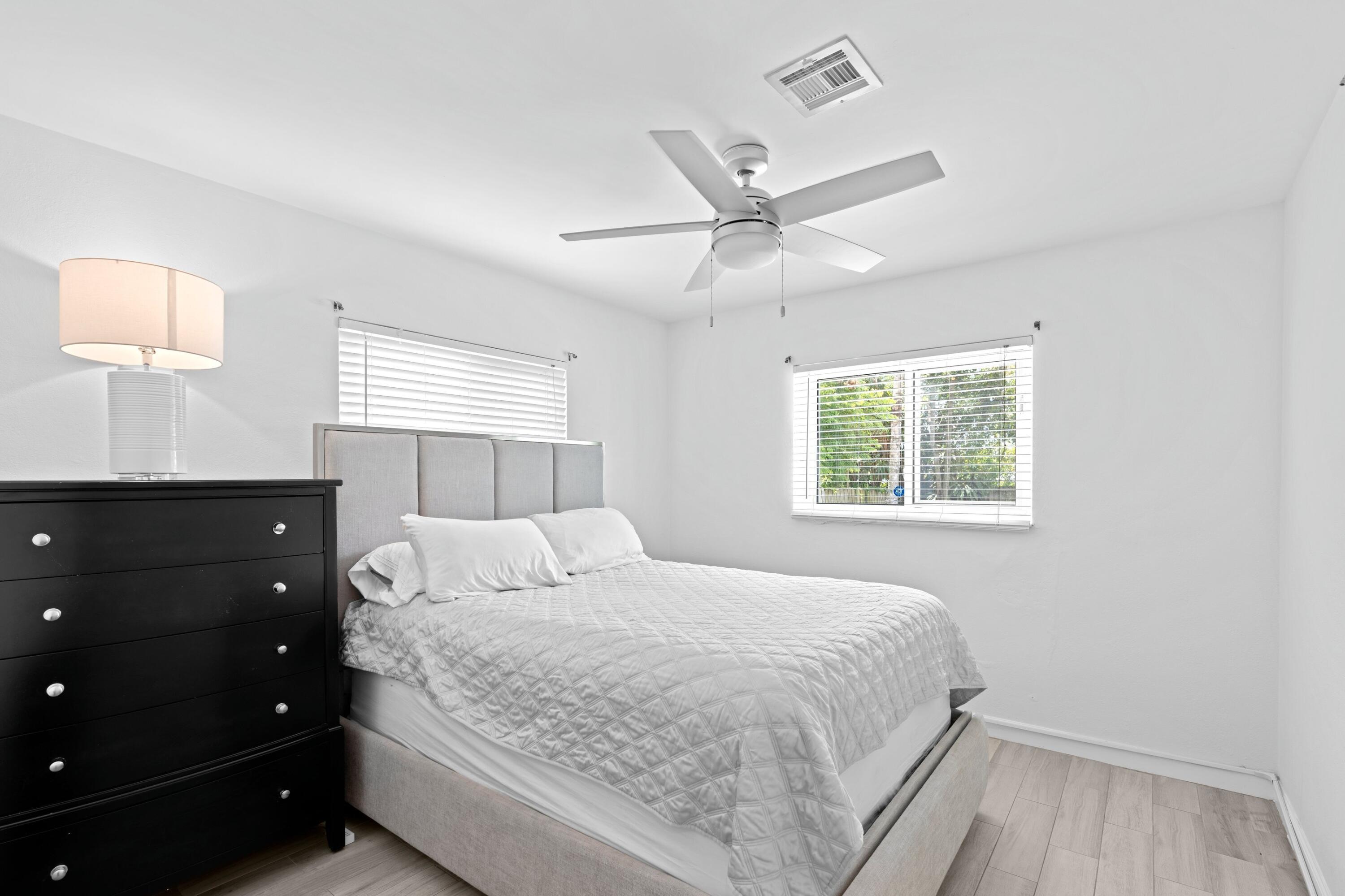 226 Southwest 13th Avenue Boynton Beach, FL 33435 - Photo 11 of 16 a bedroom with a large bed and a window