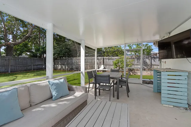 a view of a patio with swimming pool