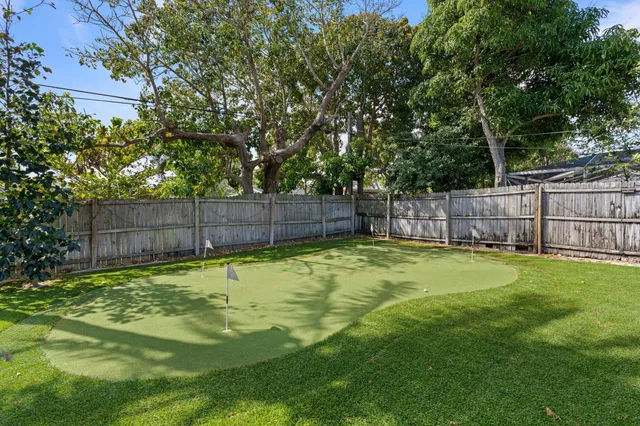 a swimming pool with wooden fence