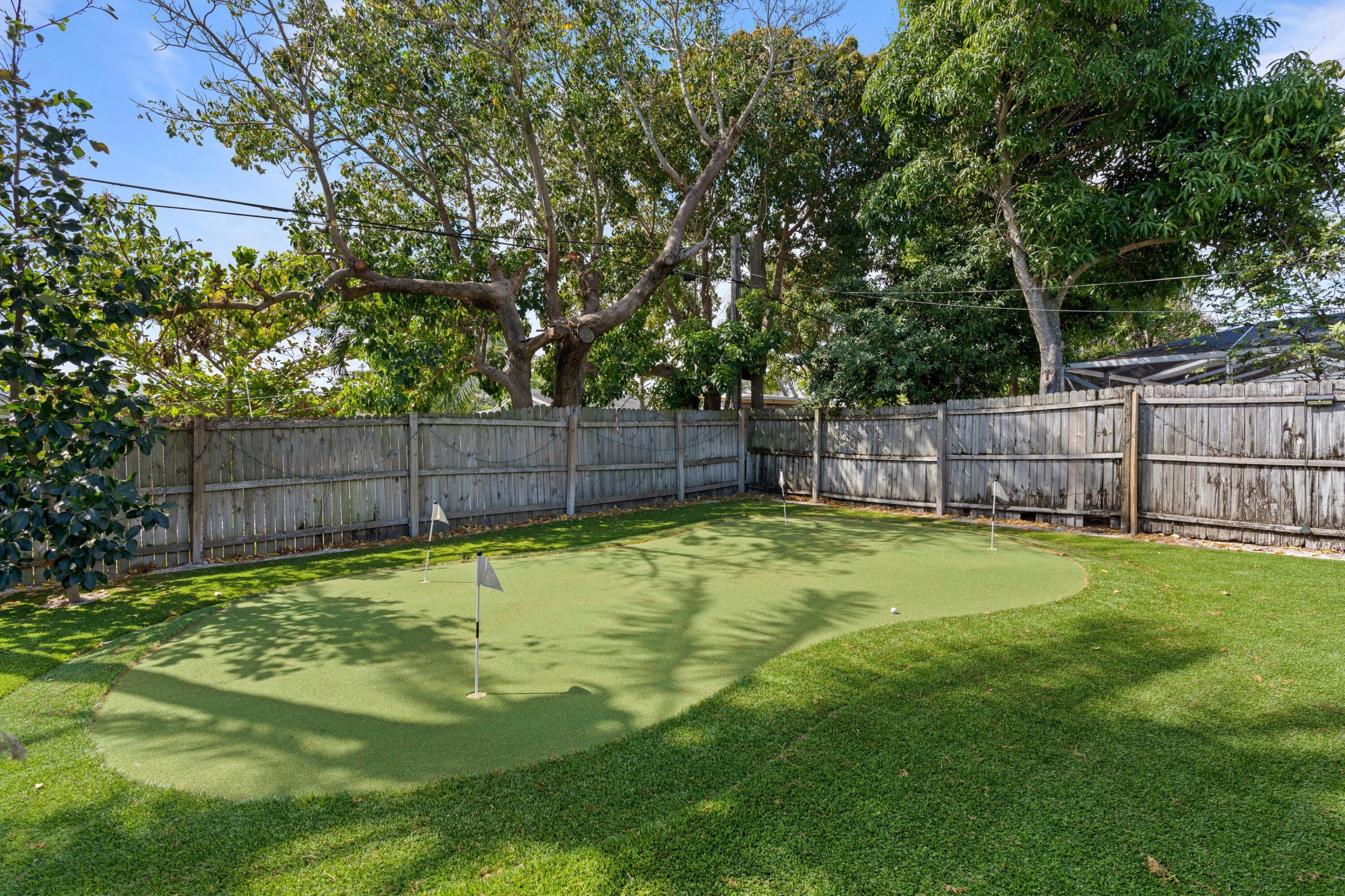 226 Southwest 13th Avenue Boynton Beach, FL 33435 - Photo 16 of 16 a swimming pool with wooden fence