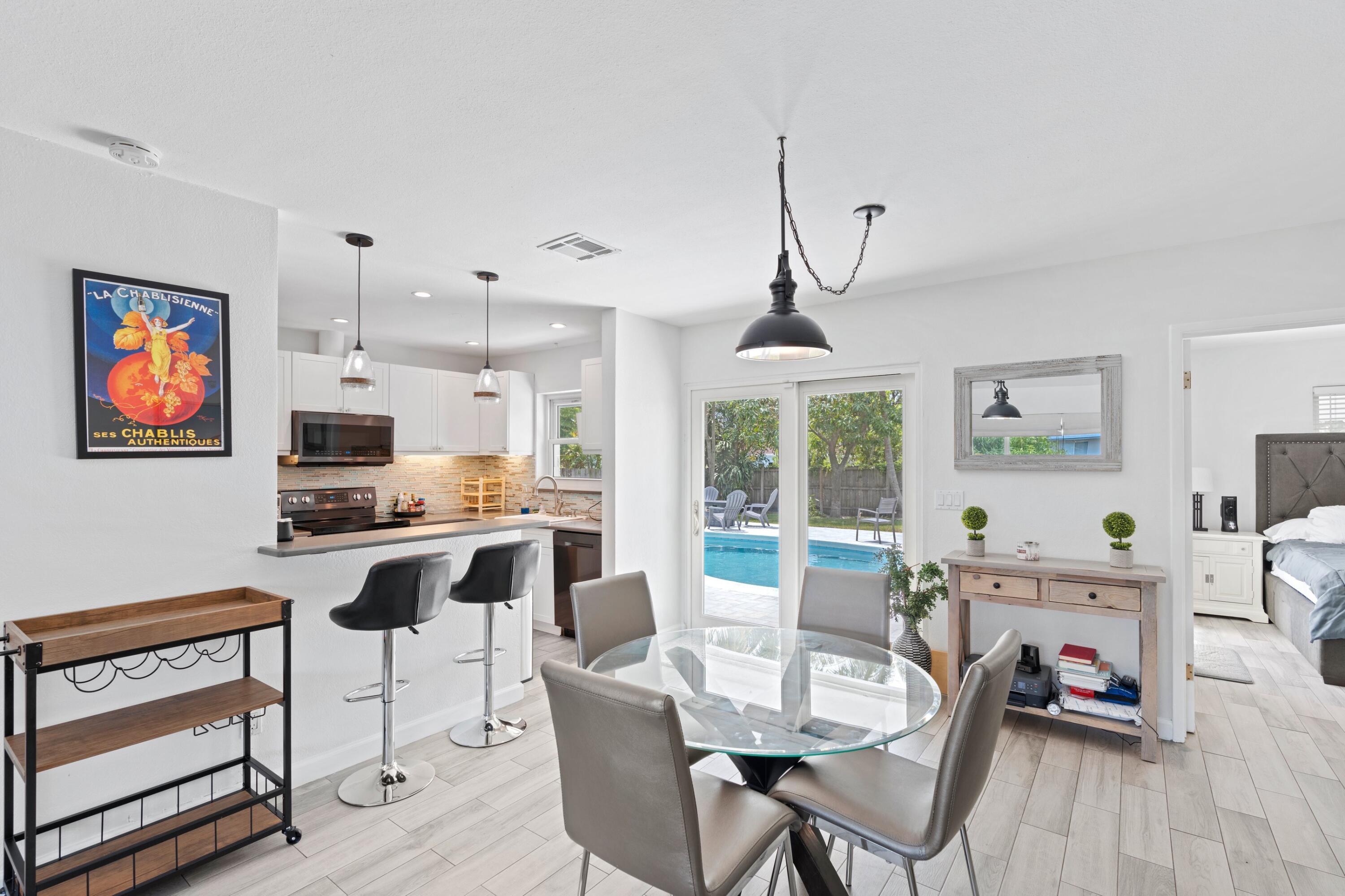 226 Southwest 13th Avenue Boynton Beach, FL 33435 - Photo 8 of 16 a view of a dining room with furniture window and outside view