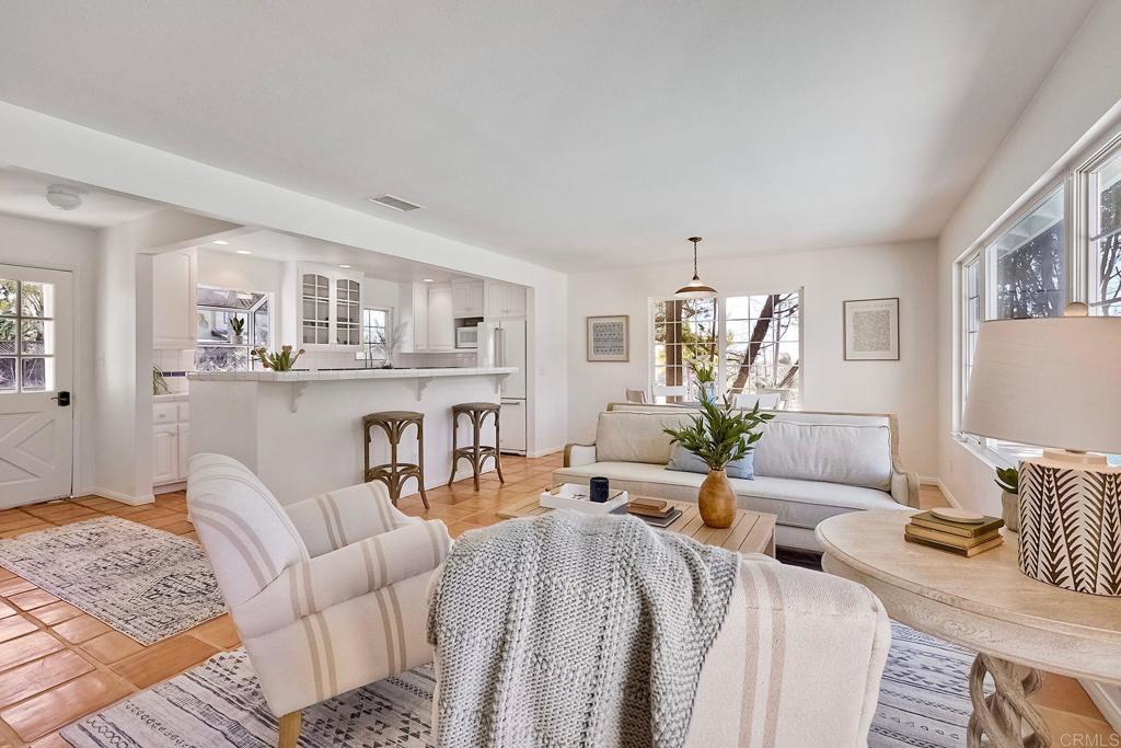 3897 Park Drive Carlsbad, CA 92008 - Photo 12 of 39 a living room with furniture a fireplace and table