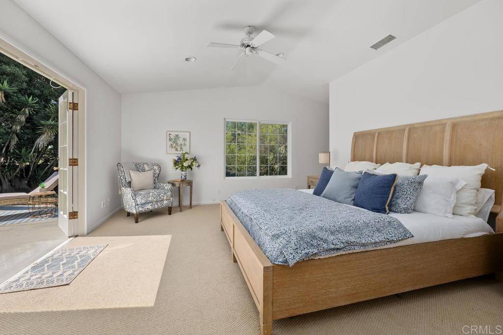 3897 Park Drive Carlsbad, CA 92008 - Photo 22 of 39 a spacious bedroom with a large bed and a couch